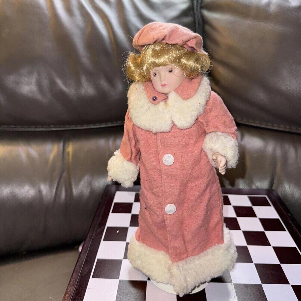 DOLL porcelain doll Black Eyes Curly Hair Long Pink Winter Coat And Hat